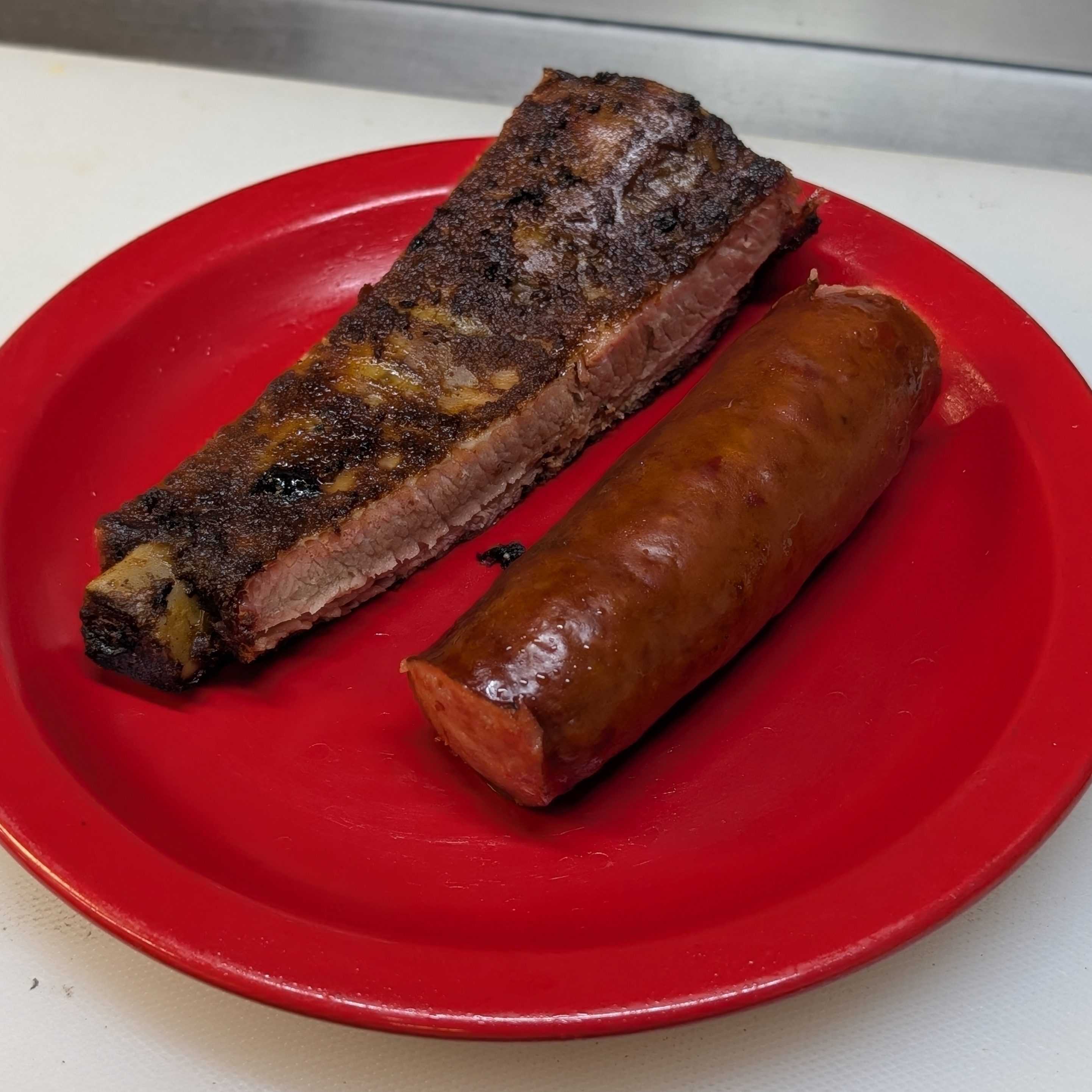 Rib (One Choice Cut Rib) Or Hot Link.